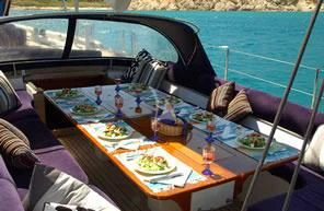 a table with food on it aboard DARK STAR OF LONDON Yacht for Charter