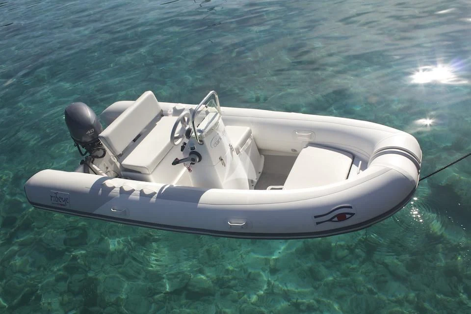 a white boat in the water aboard DARK STAR OF LONDON Yacht for Charter