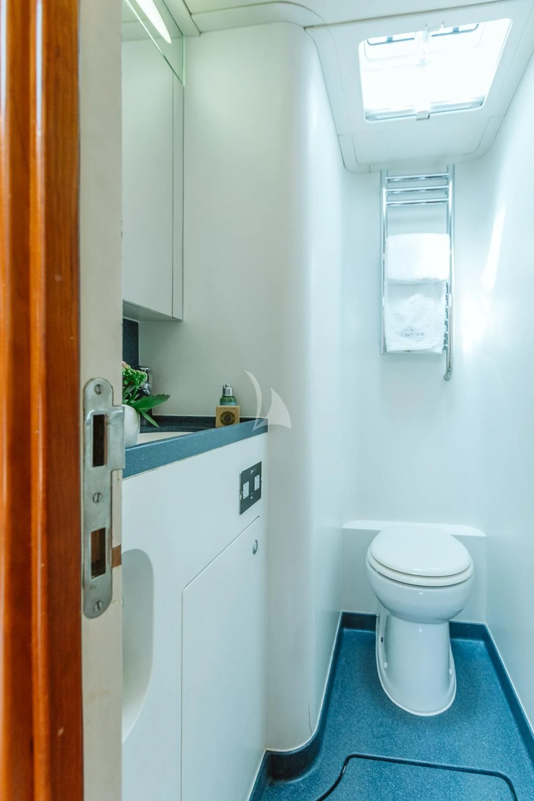 a bathroom with a toilet and sink aboard DARK STAR OF LONDON Yacht for Charter
