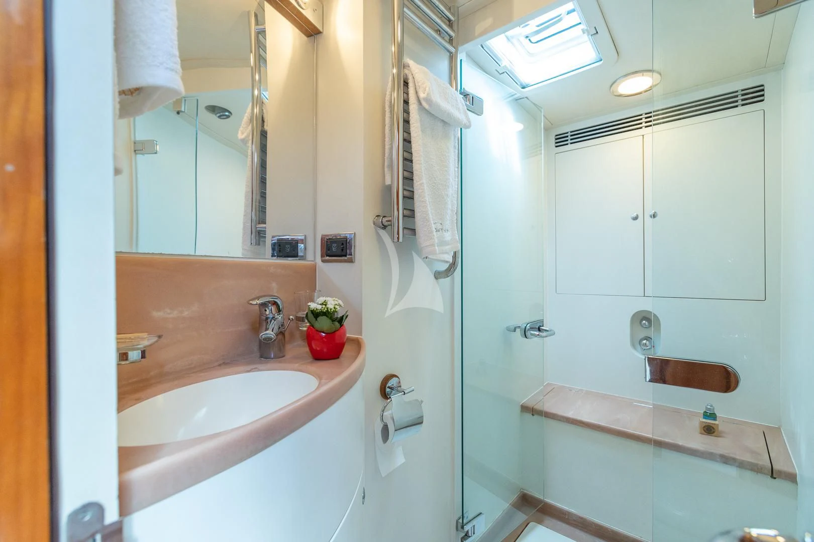 a bathroom with a sink and a mirror aboard DARK STAR OF LONDON Yacht for Charter