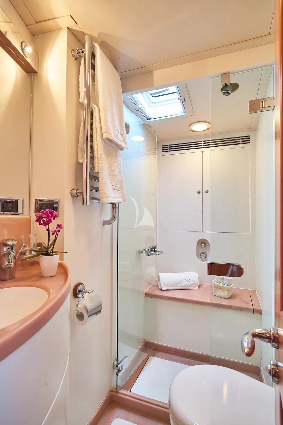 a bathroom with a sink and a shower aboard DARK STAR OF LONDON Yacht for Charter