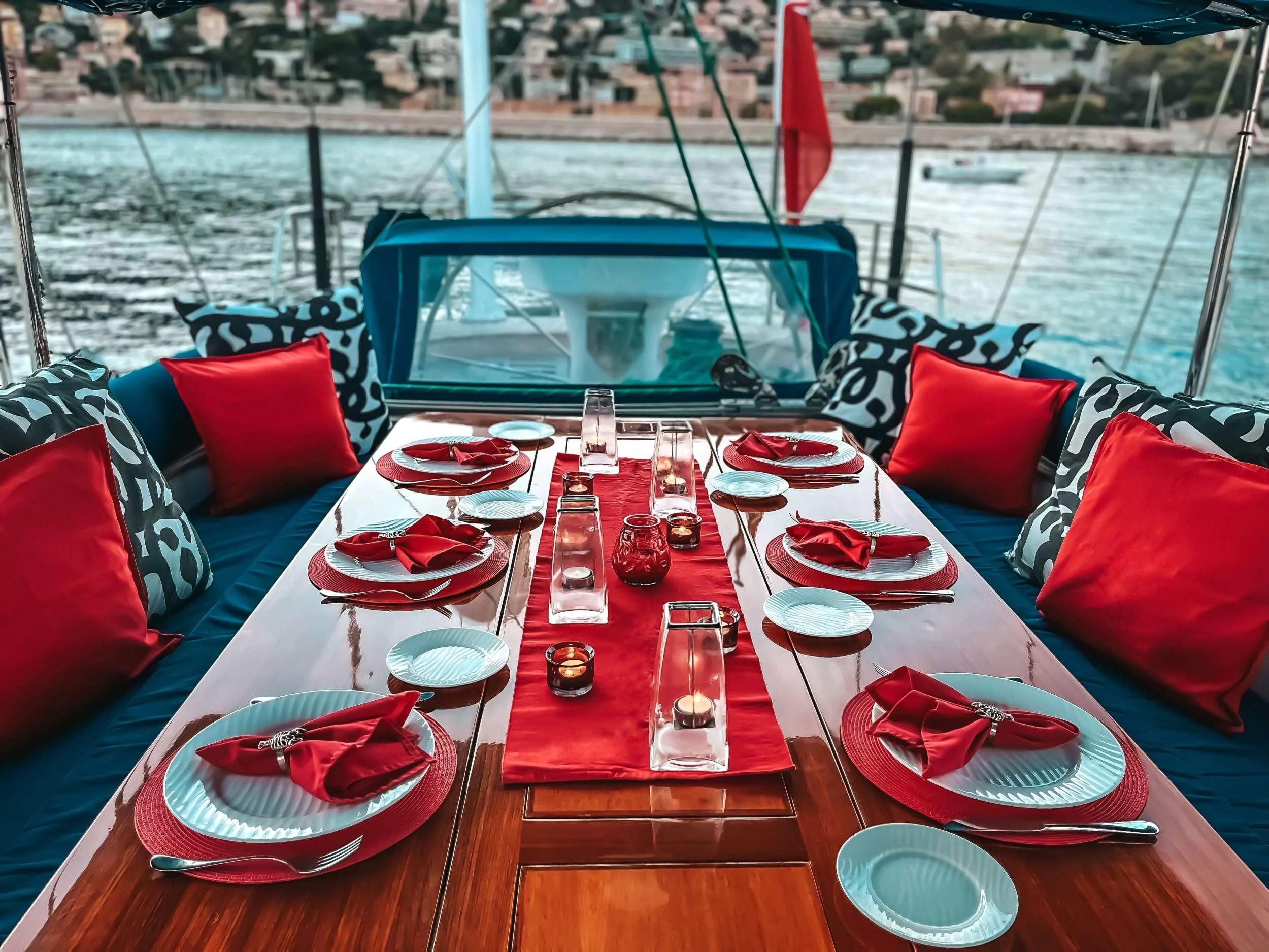 a table with plates and cups on it aboard DARK STAR OF LONDON Yacht for Charter