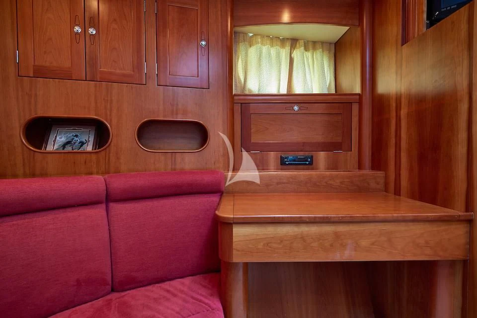 a couch and a television in a room aboard DARK STAR OF LONDON Yacht for Charter