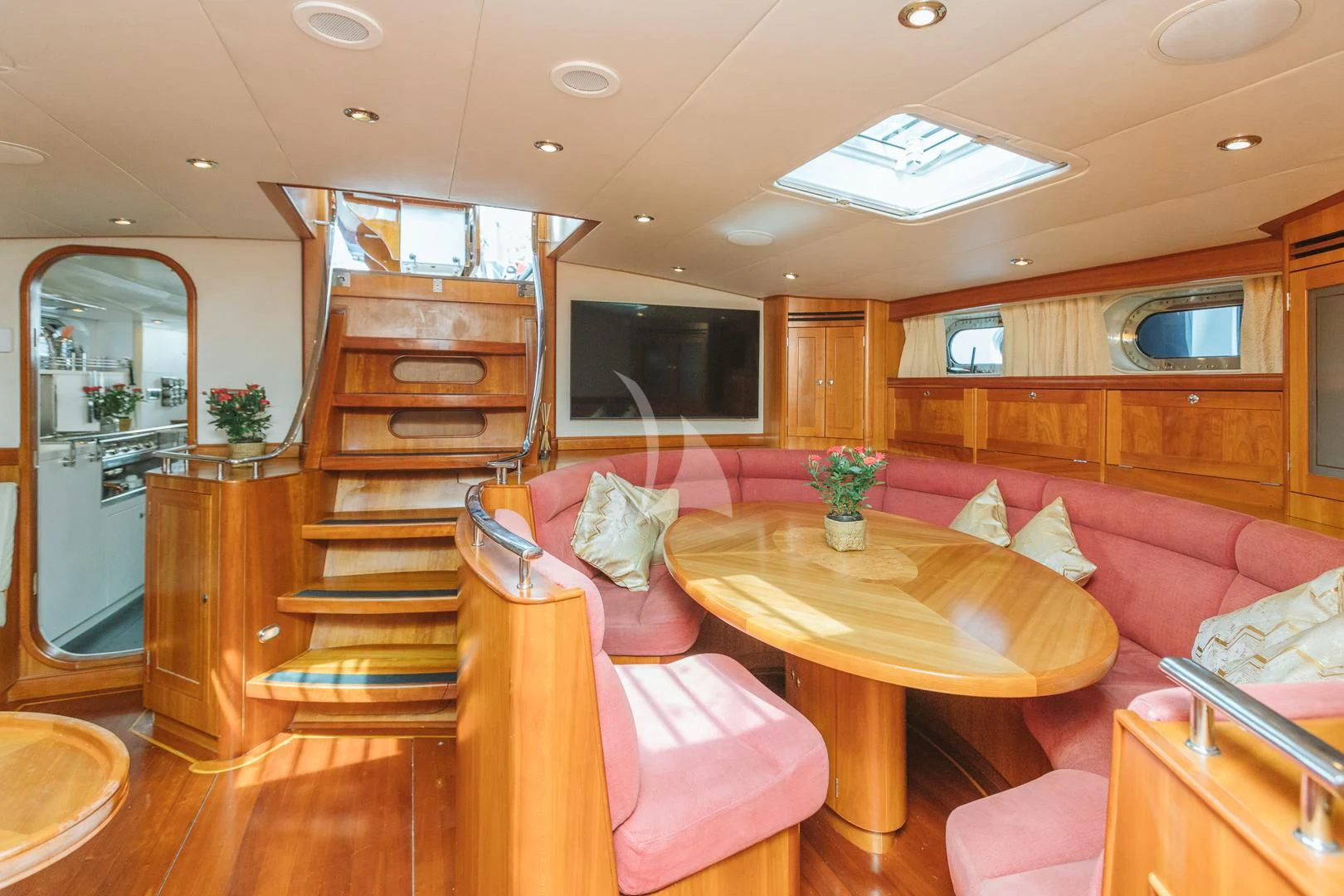 a living room with a staircase aboard DARK STAR OF LONDON Yacht for Charter