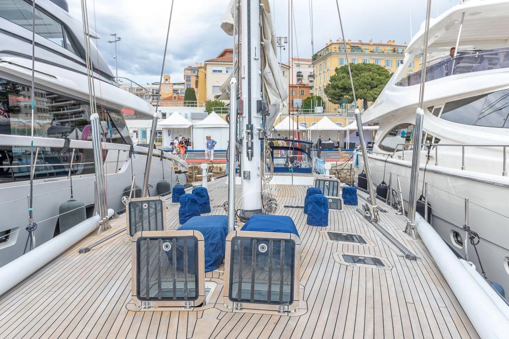 a deck with boats and people on it aboard DARK STAR OF LONDON Yacht for Charter