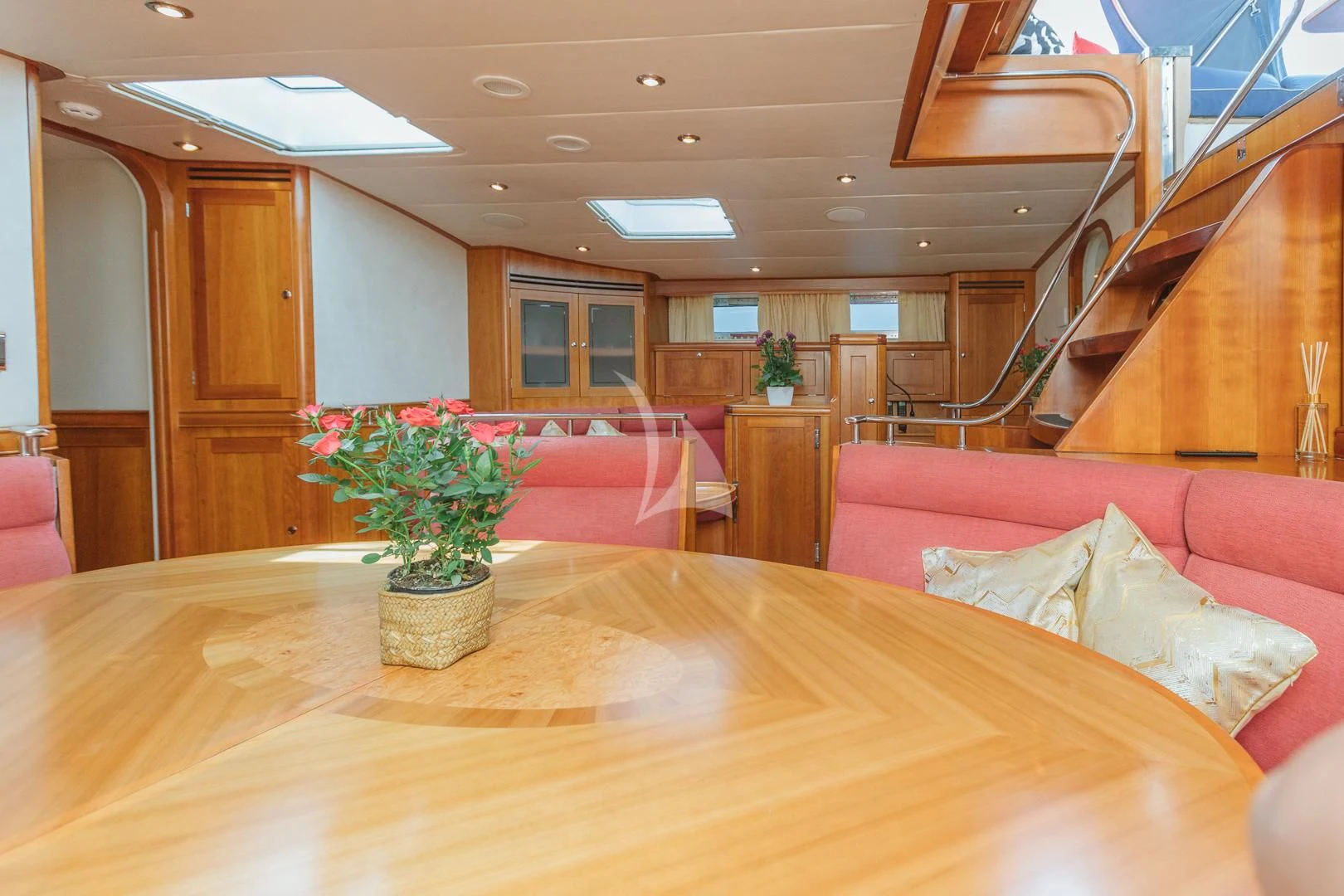 a room with a table and couches aboard DARK STAR OF LONDON Yacht for Charter