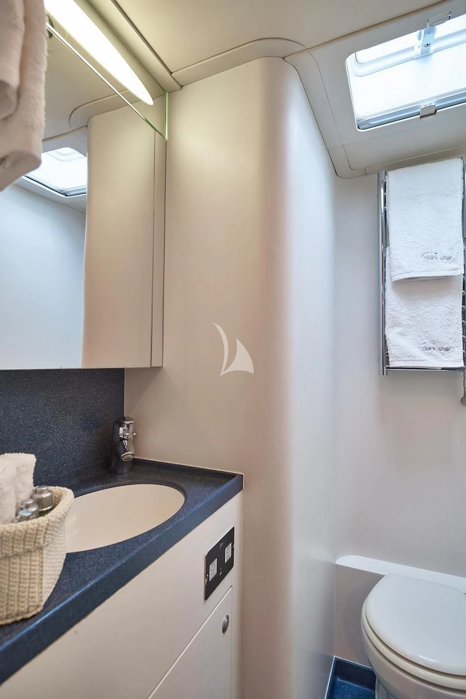a bathroom with a sink and toilet aboard DARK STAR OF LONDON Yacht for Charter