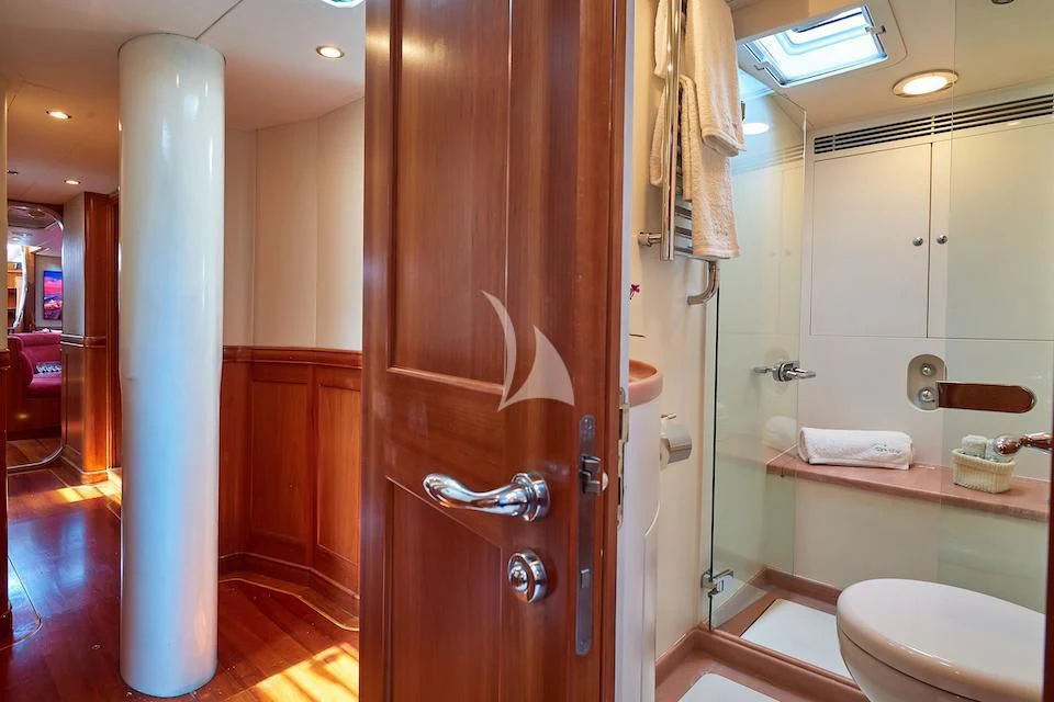 a bathroom with a standup shower aboard DARK STAR OF LONDON Yacht for Charter