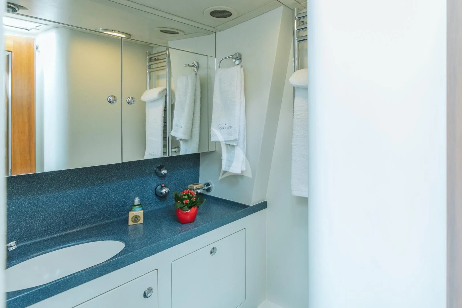 a bathroom with a sink and a mirror aboard DARK STAR OF LONDON Yacht for Charter