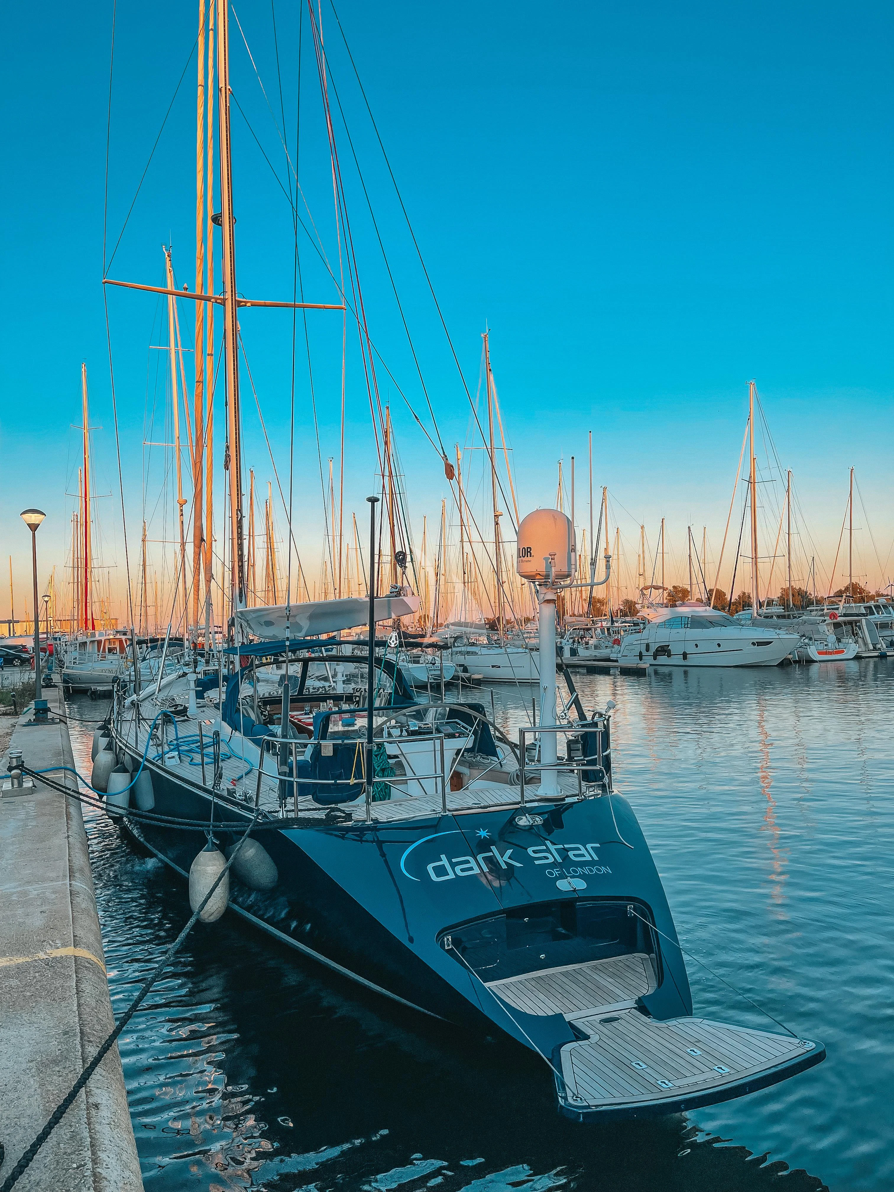 a boat docked at a pier aboard DARK STAR OF LONDON Yacht for Charter
