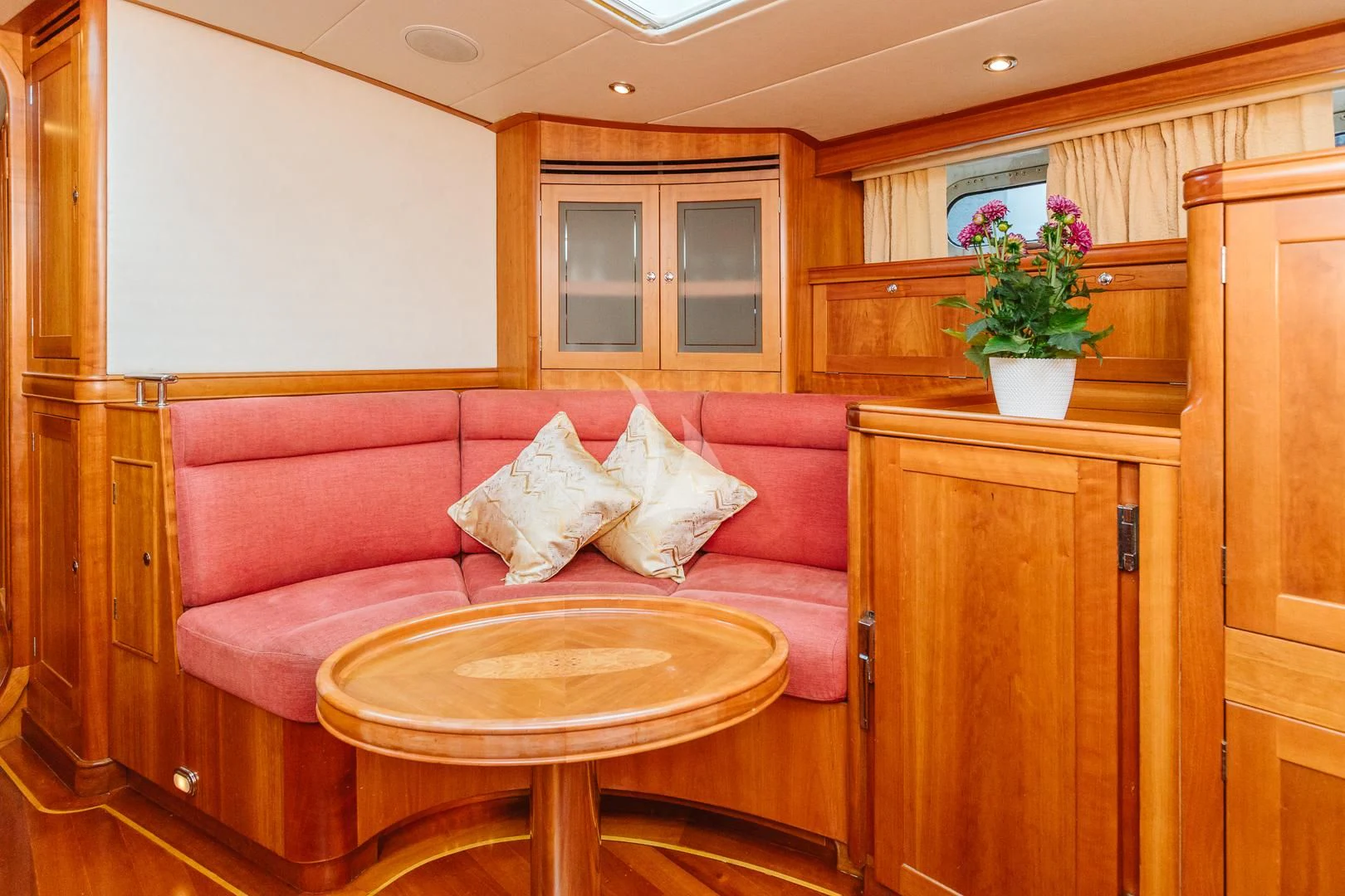 a pink couch in a room aboard DARK STAR OF LONDON Yacht for Charter