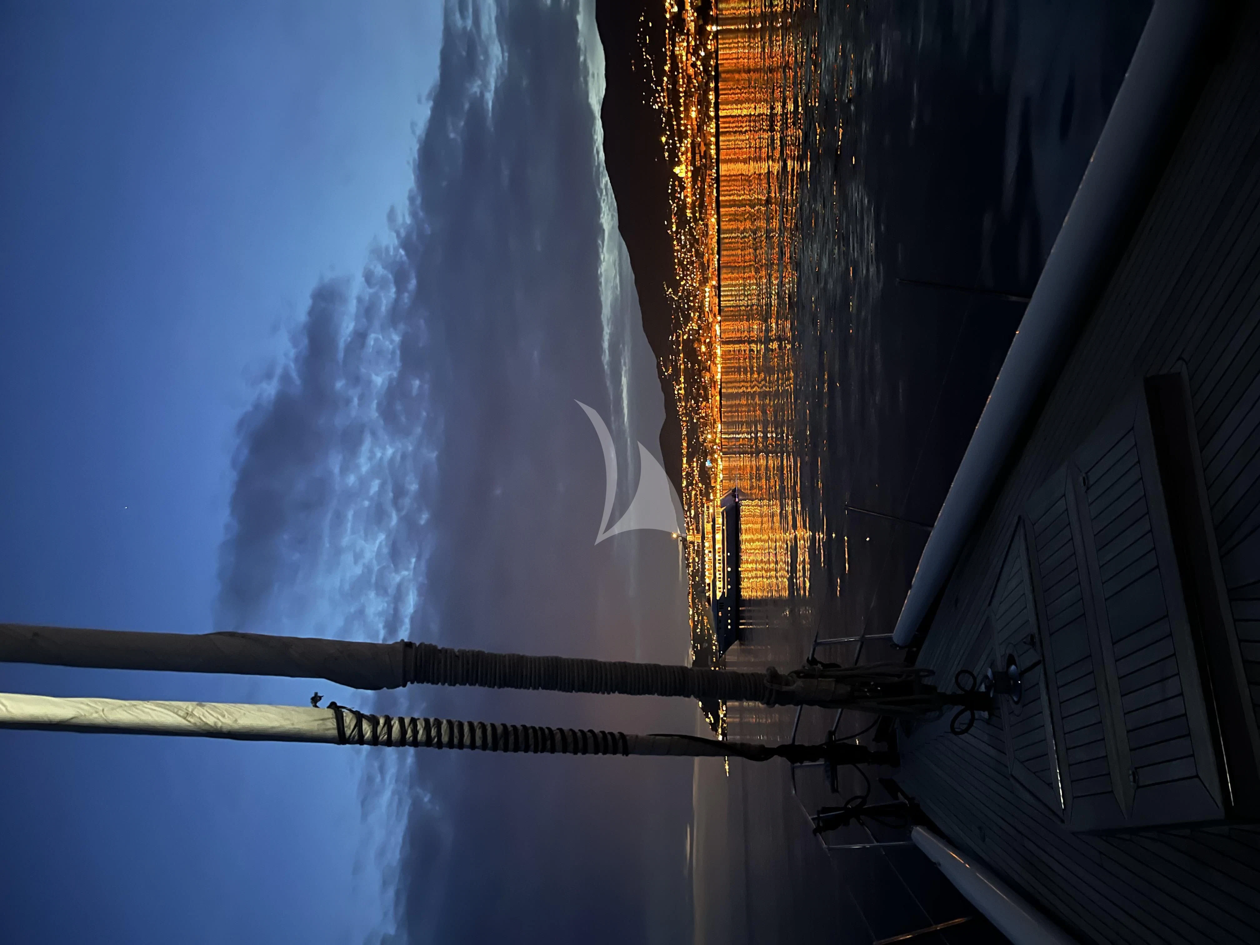 a building with smoke coming out of it aboard DARK STAR OF LONDON Yacht for Charter