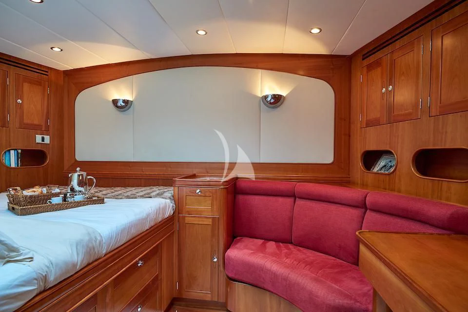 a room with wooden cabinets aboard DARK STAR OF LONDON Yacht for Charter