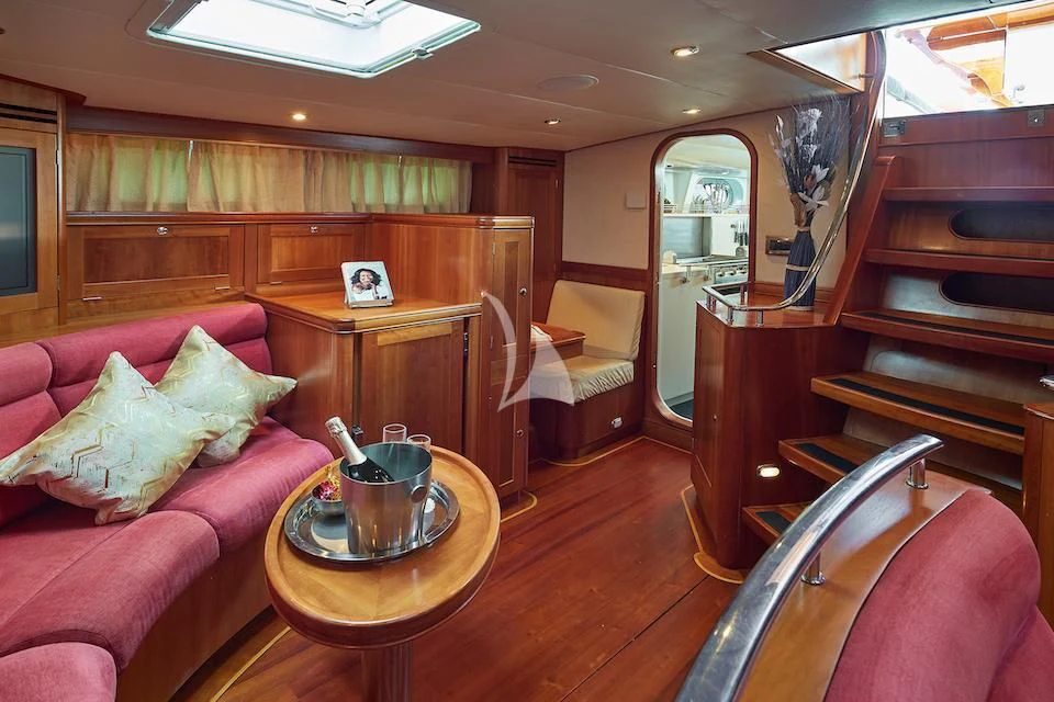 a living room with a piano aboard DARK STAR OF LONDON Yacht for Charter