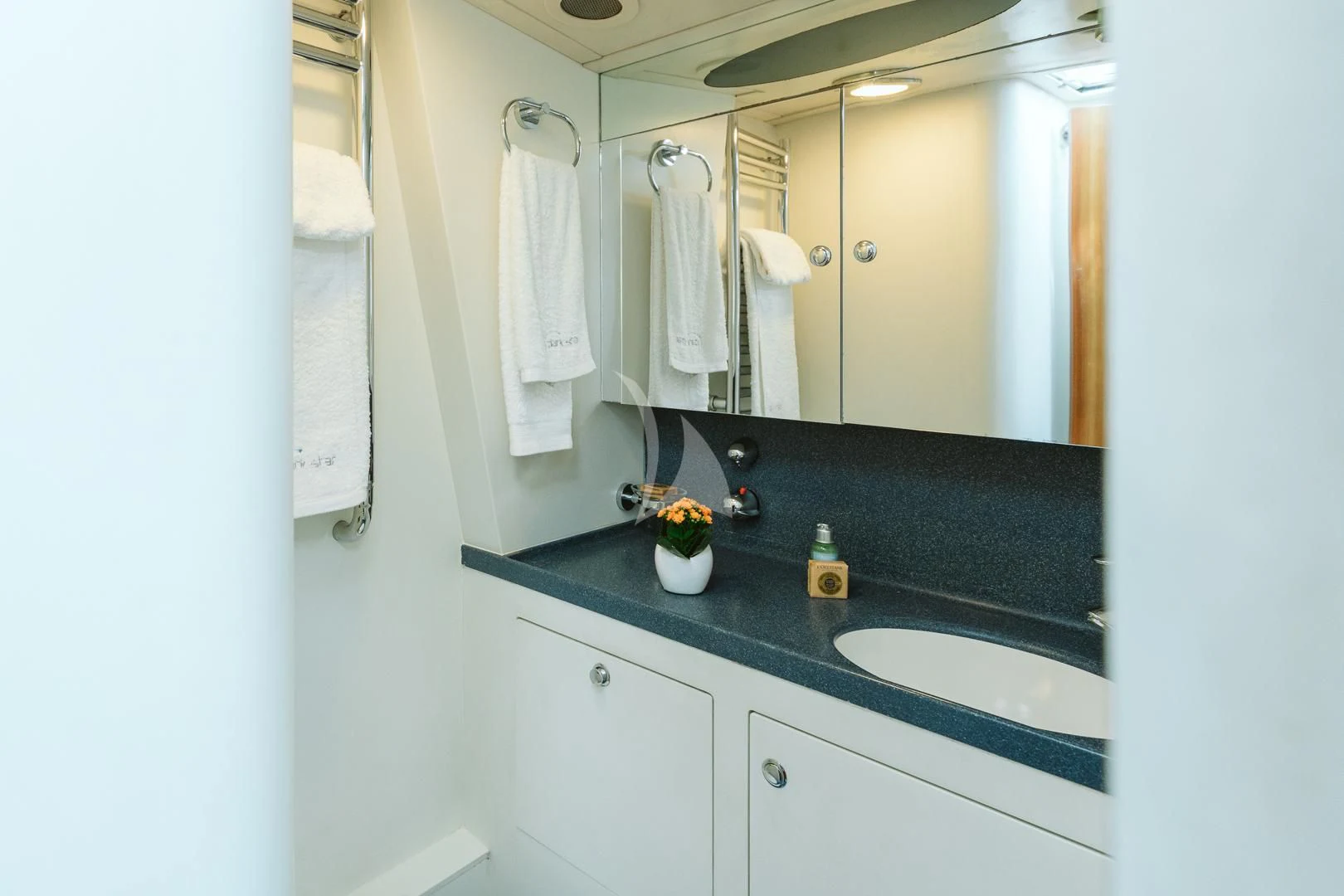 a bathroom with a large mirror aboard DARK STAR OF LONDON Yacht for Charter