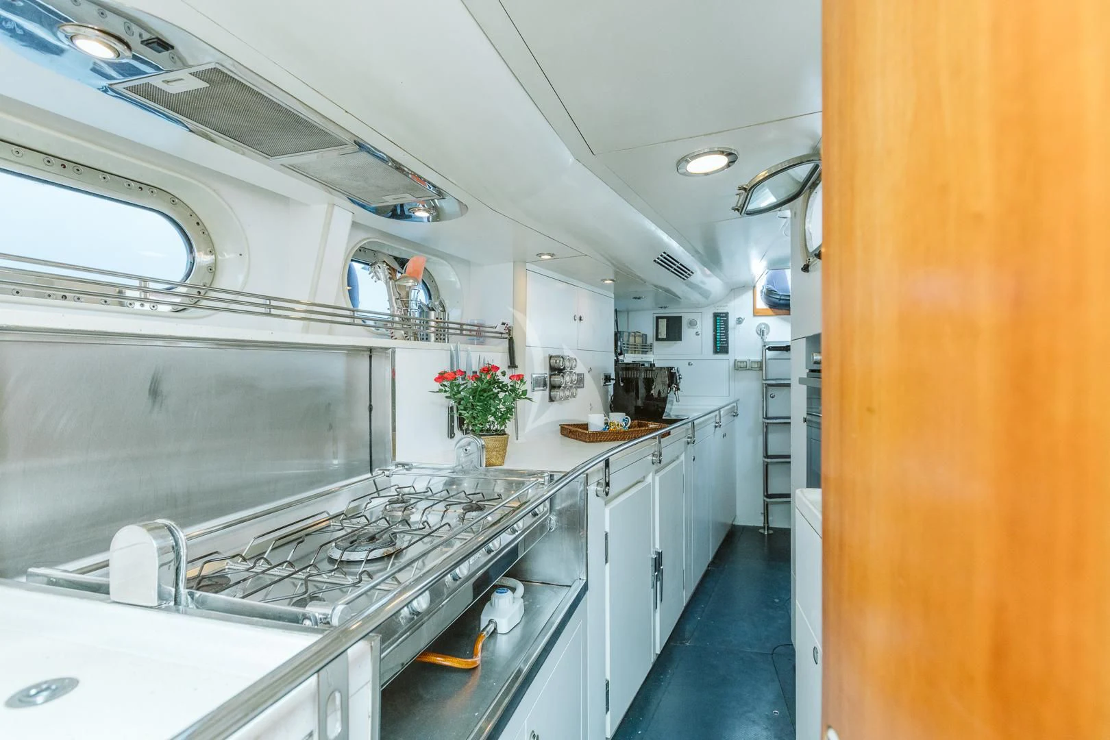 a kitchen with a large island aboard DARK STAR OF LONDON Yacht for Charter