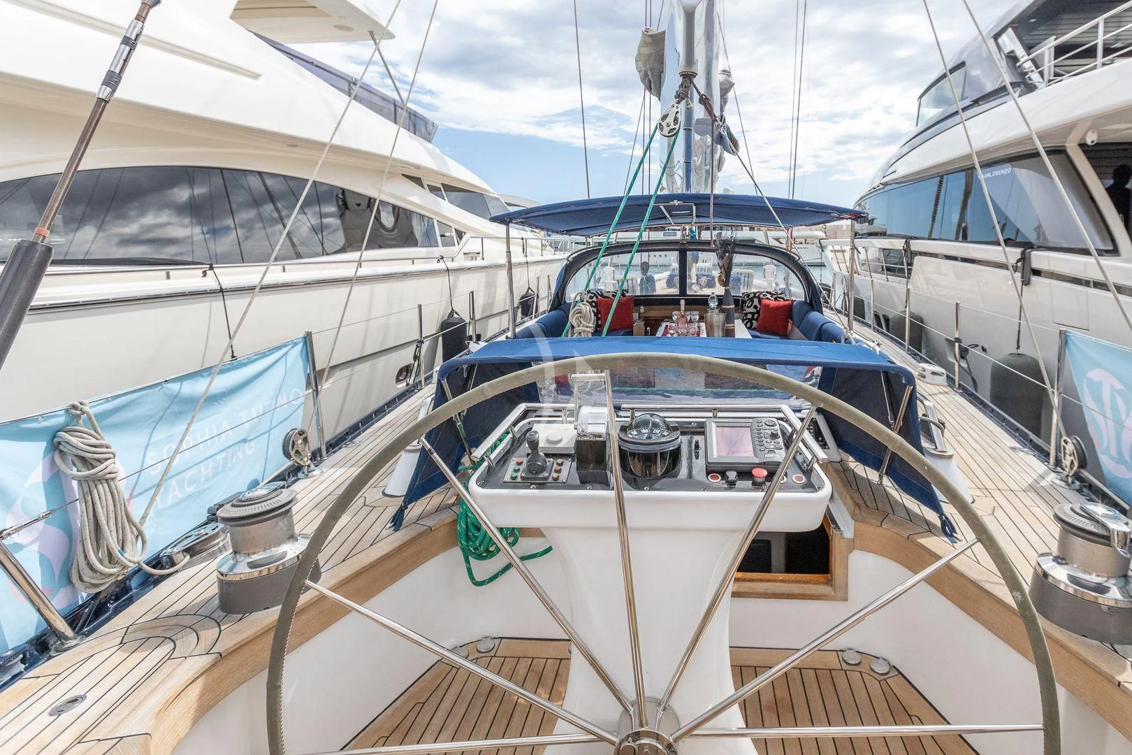a group of boats in a harbor aboard DARK STAR OF LONDON Yacht for Charter