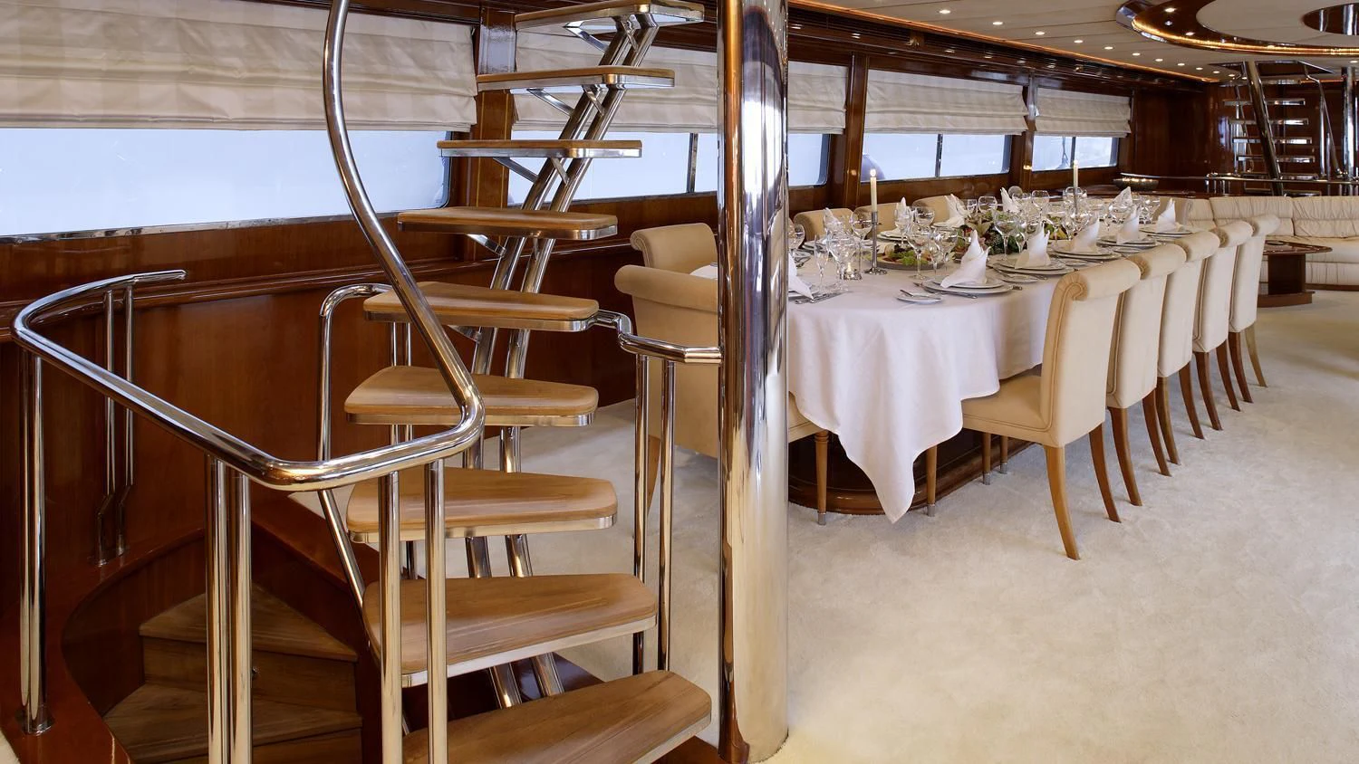 a table set for a banquet aboard CORVUS Yacht for Sale