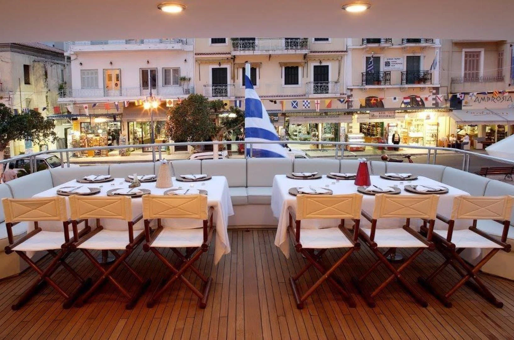 a restaurant with tables and chairs aboard CORVUS Yacht for Sale
