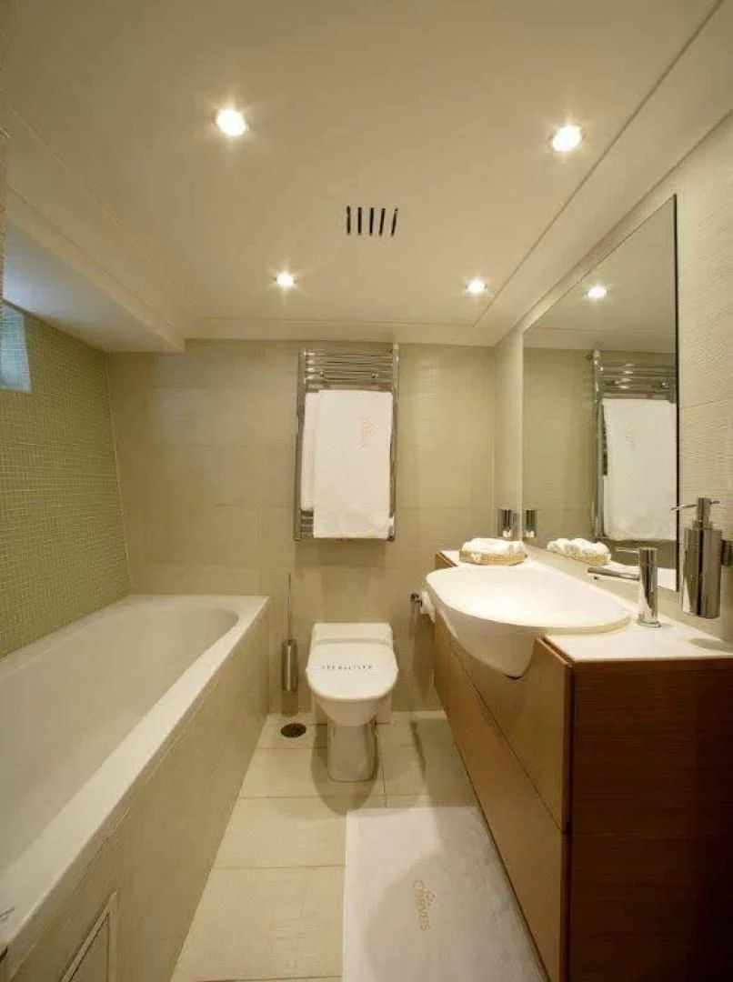 a bathroom with a toilet and a sink aboard CORVUS Yacht for Sale
