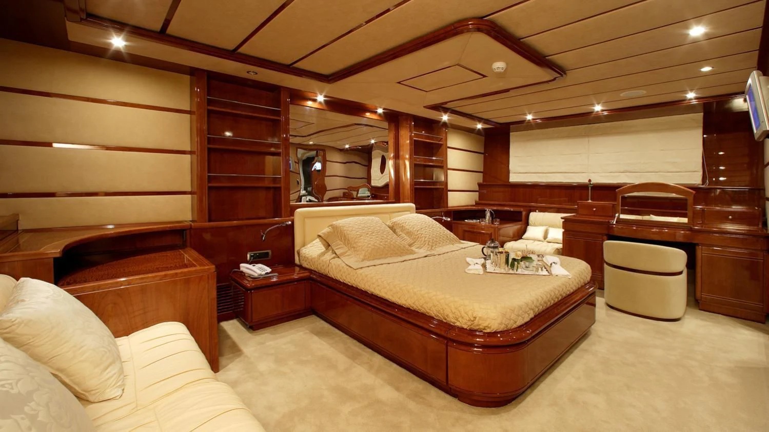 a large bed in a room aboard CORVUS Yacht for Sale