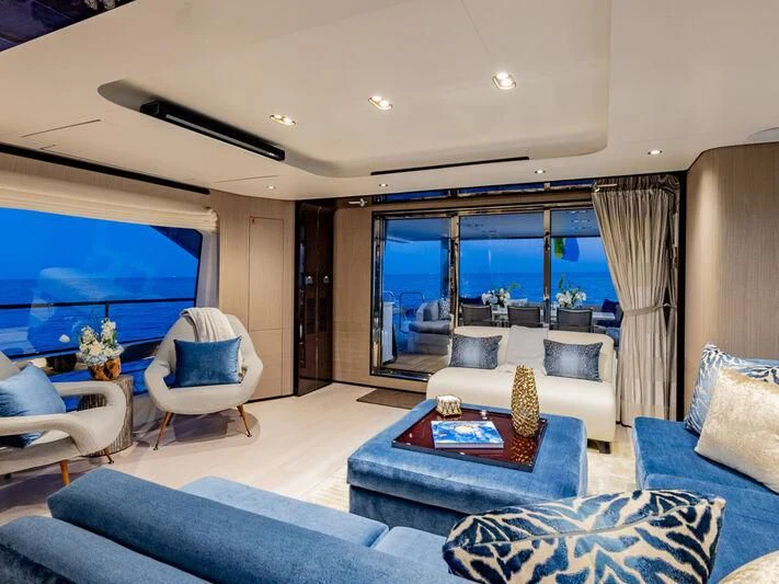a living room with a large window aboard CAPTAIN MORGAN II Yacht for Sale