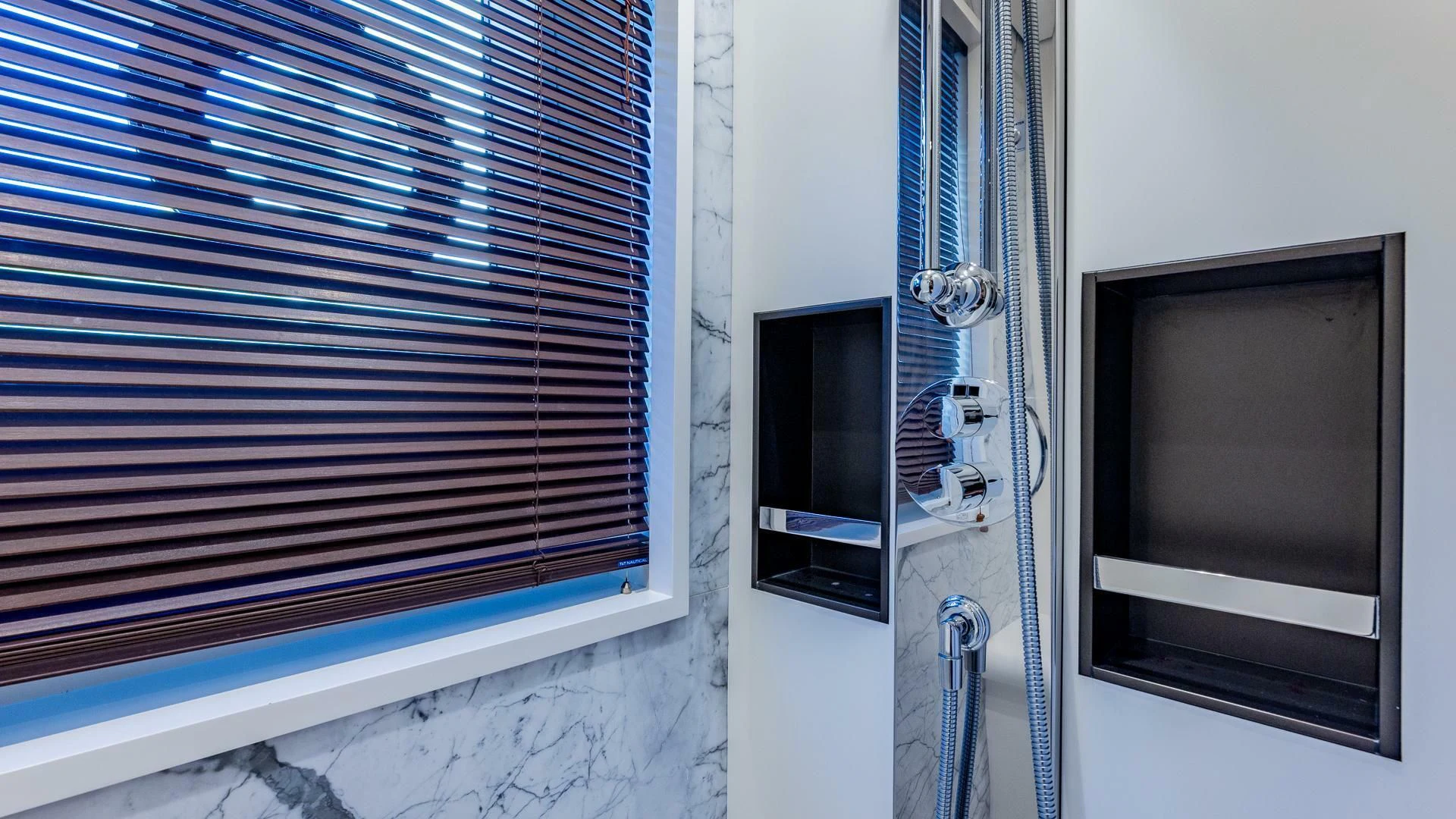 a window with a vent aboard CAPTAIN MORGAN II Yacht for Sale