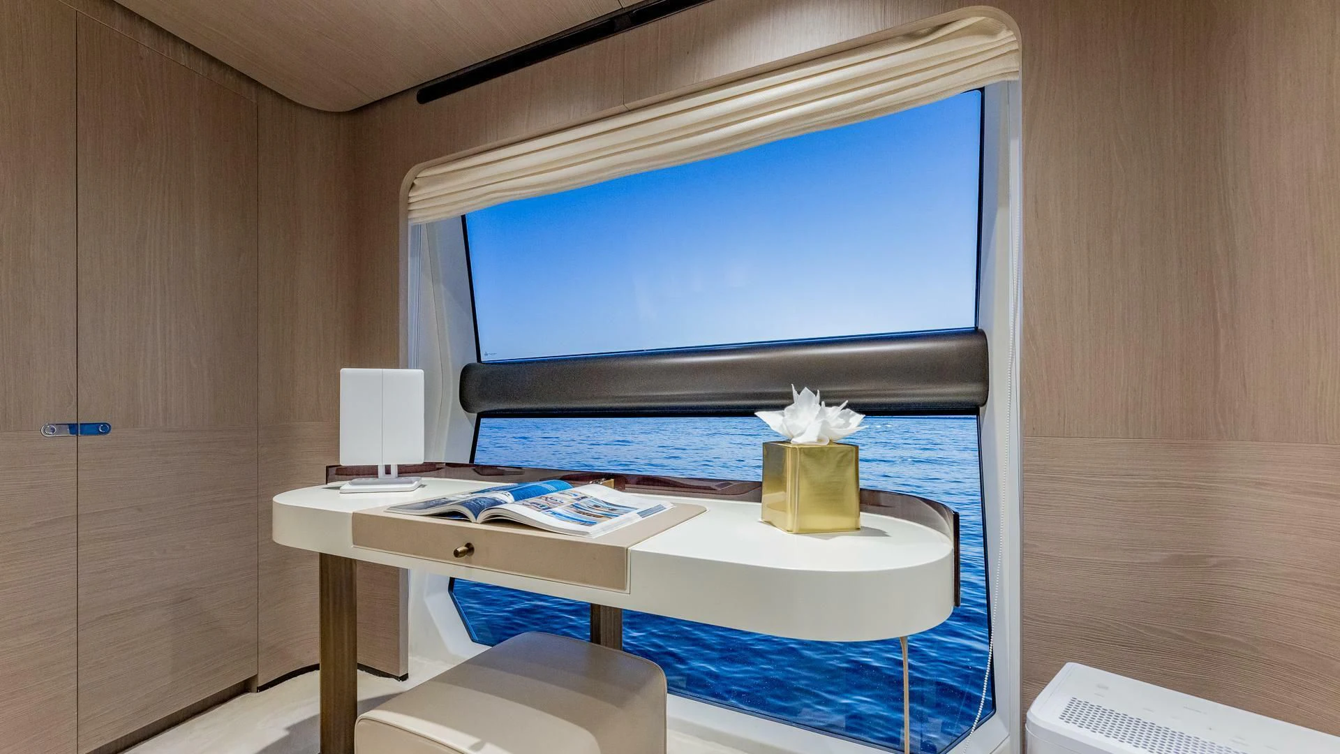 a desk with a computer and a television aboard CAPTAIN MORGAN II Yacht for Sale