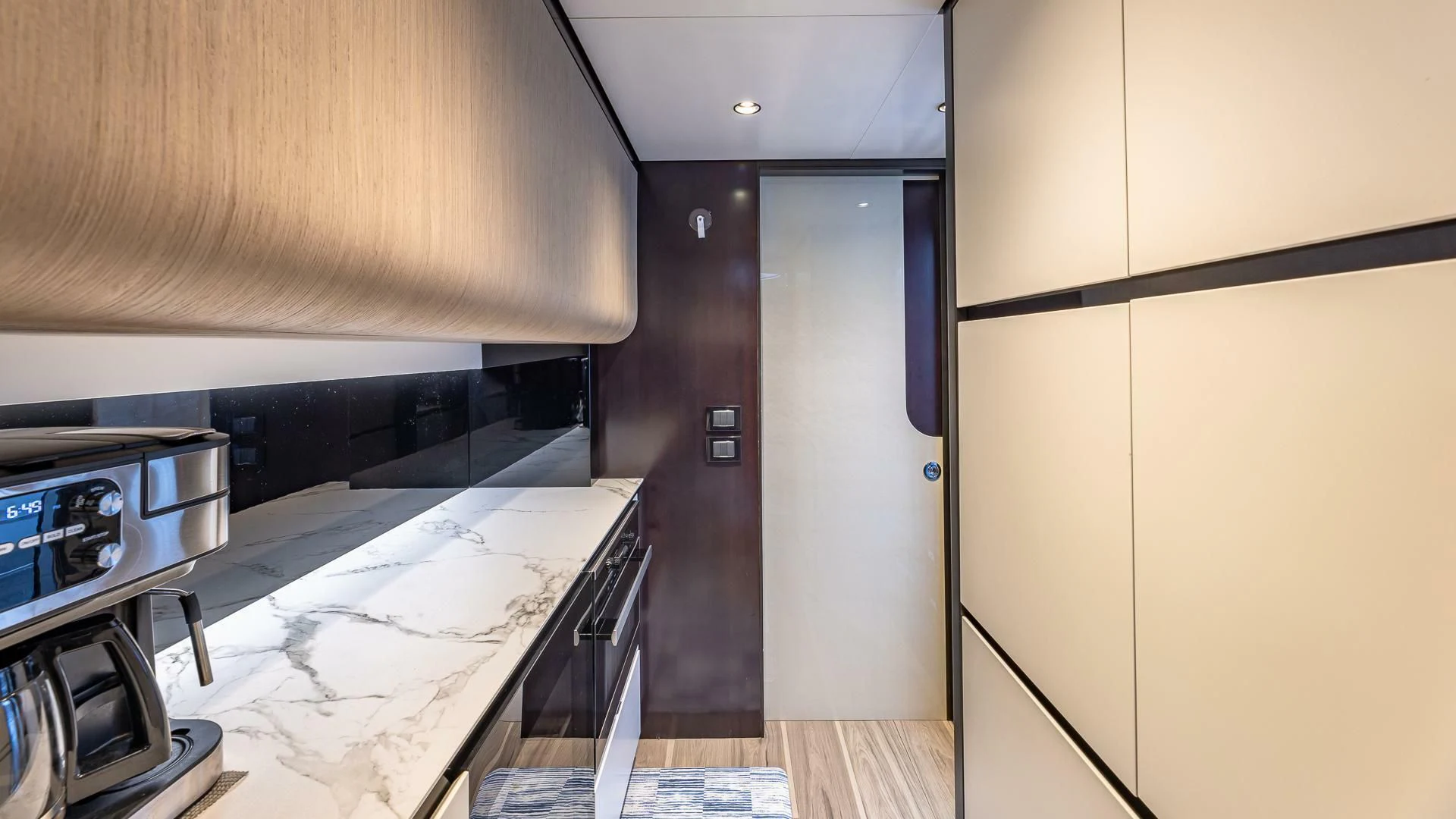 a kitchen with a large sink and a large refrigerator aboard CAPTAIN MORGAN II Yacht for Sale