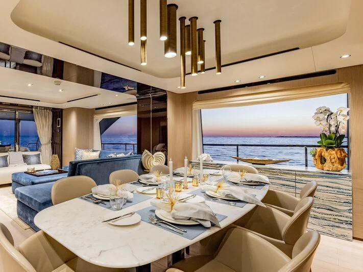 a large dining room with a large window aboard CAPTAIN MORGAN II Yacht for Sale