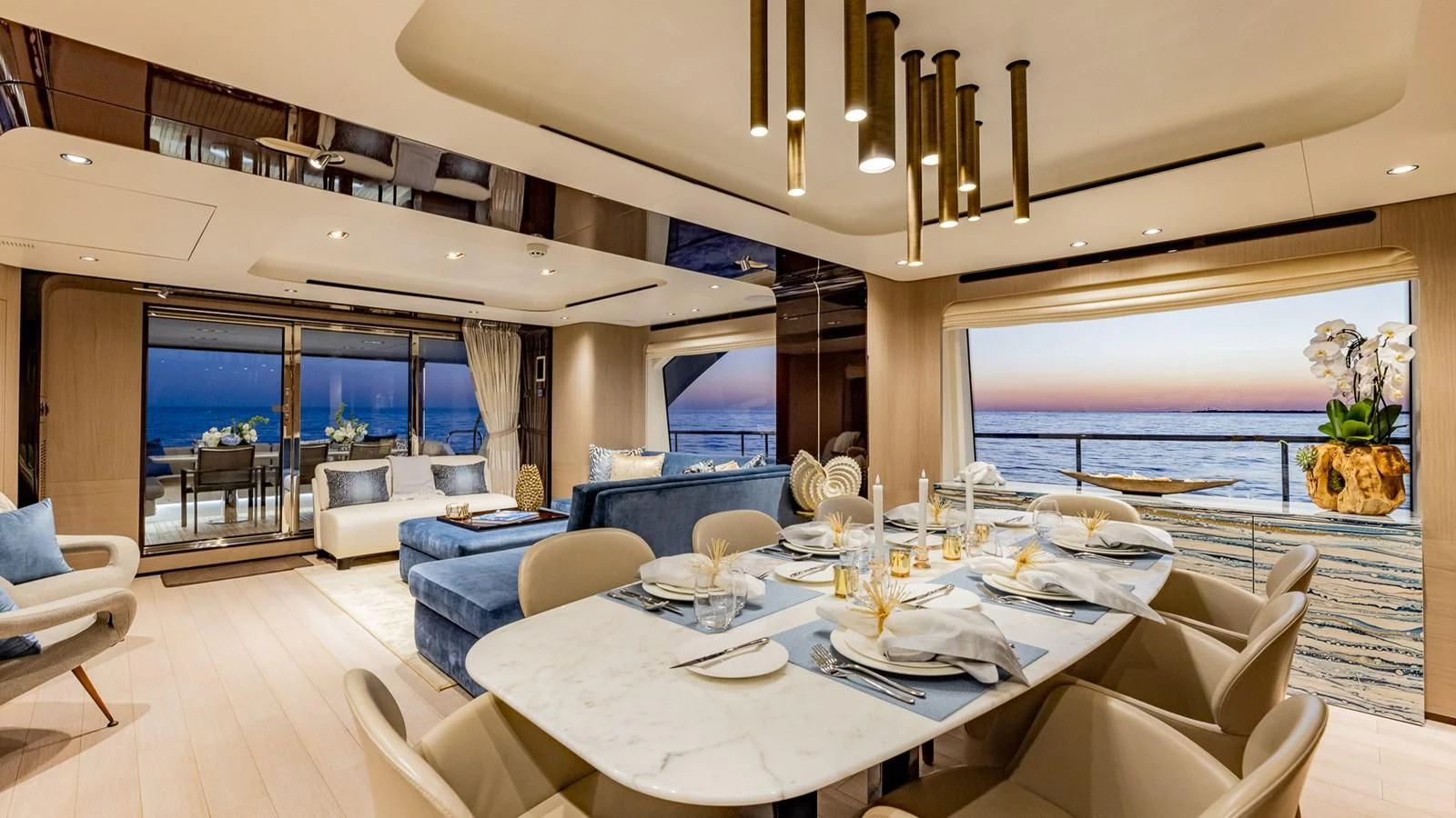 a large room with a table and chairs aboard CAPTAIN MORGAN II Yacht for Sale