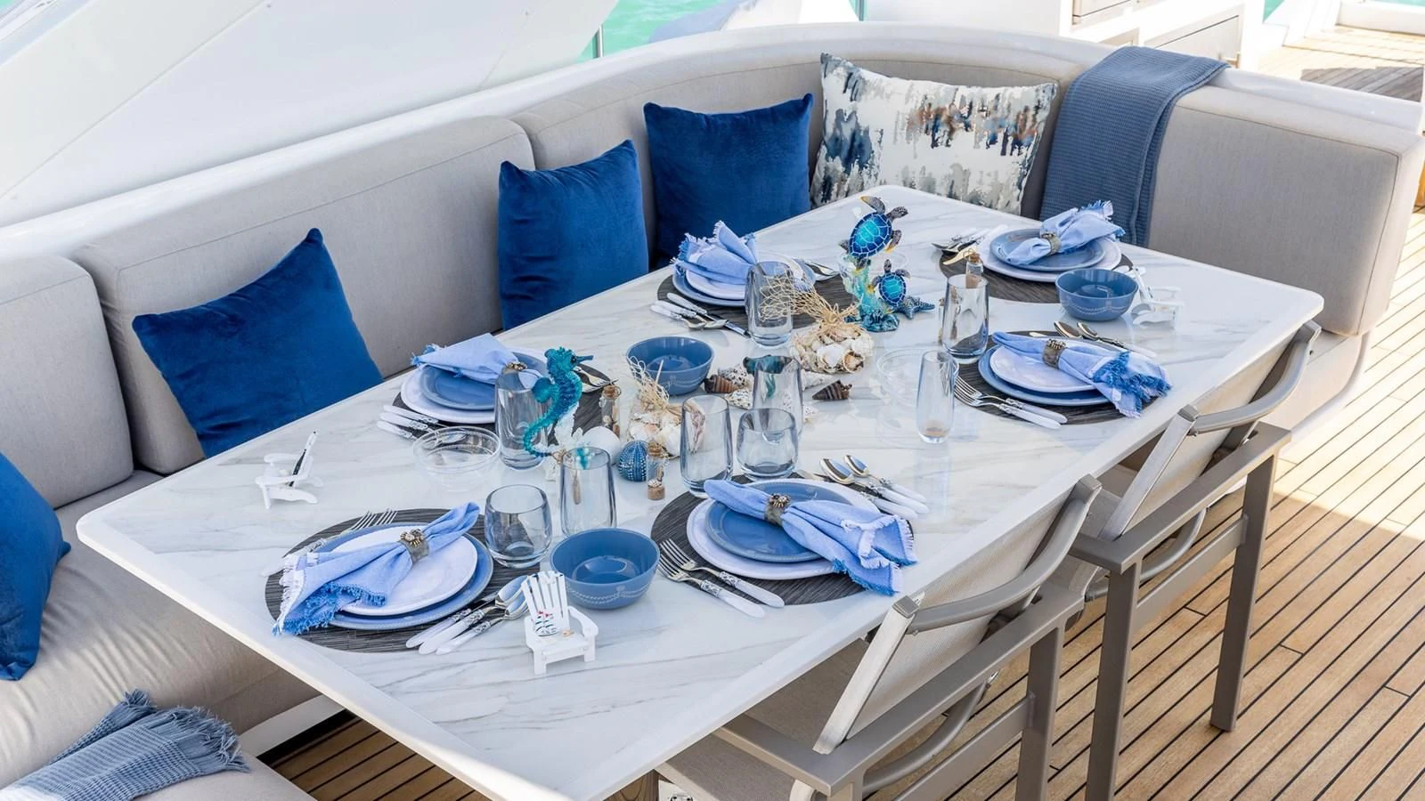 a table with plates and silverware aboard CAPTAIN MORGAN II Yacht for Sale