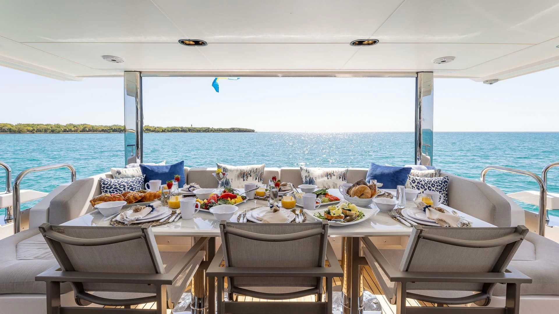 a table set for a meal on a boat aboard CAPTAIN MORGAN II Yacht for Sale