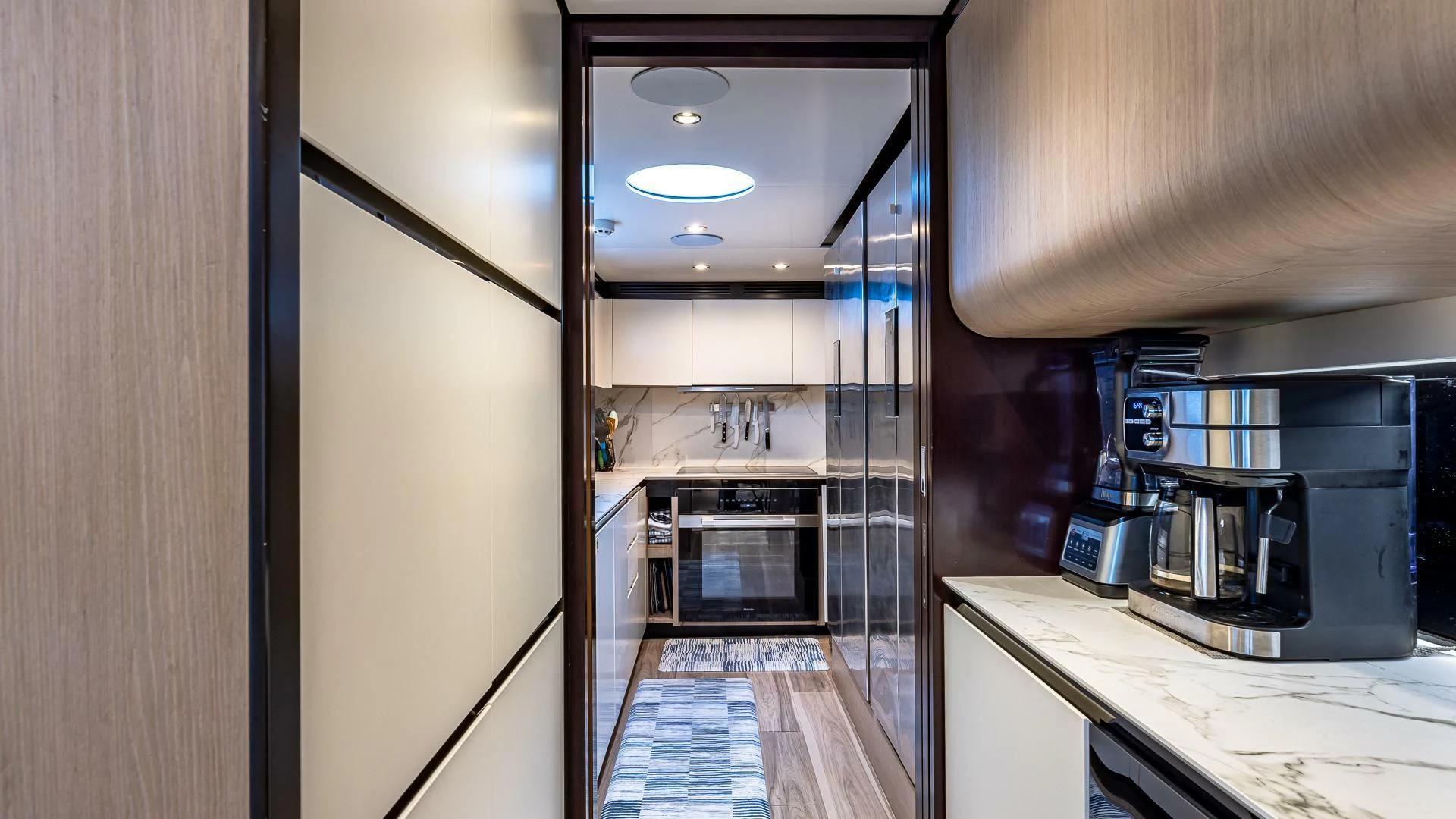 a kitchen with a stainless steel oven aboard CAPTAIN MORGAN II Yacht for Sale