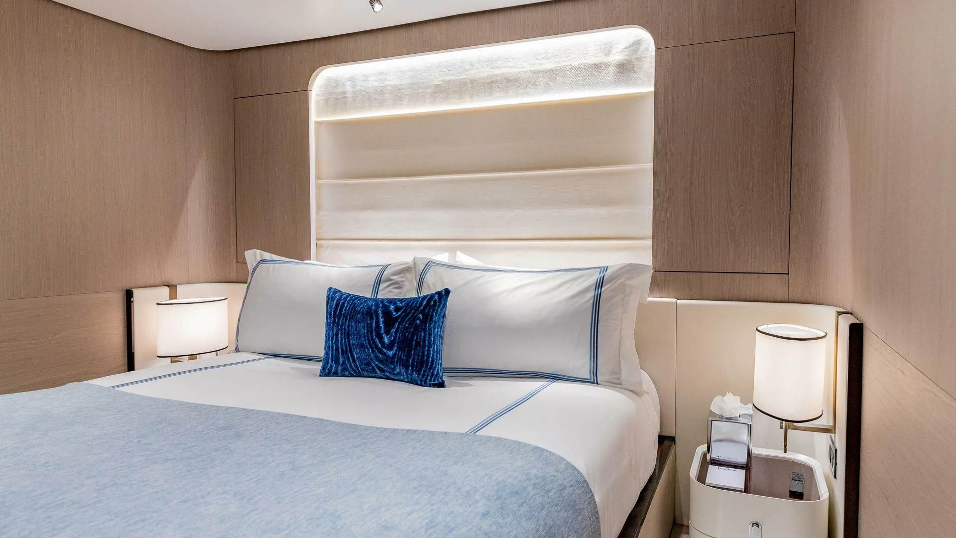 a bed with white sheets aboard CAPTAIN MORGAN II Yacht for Sale