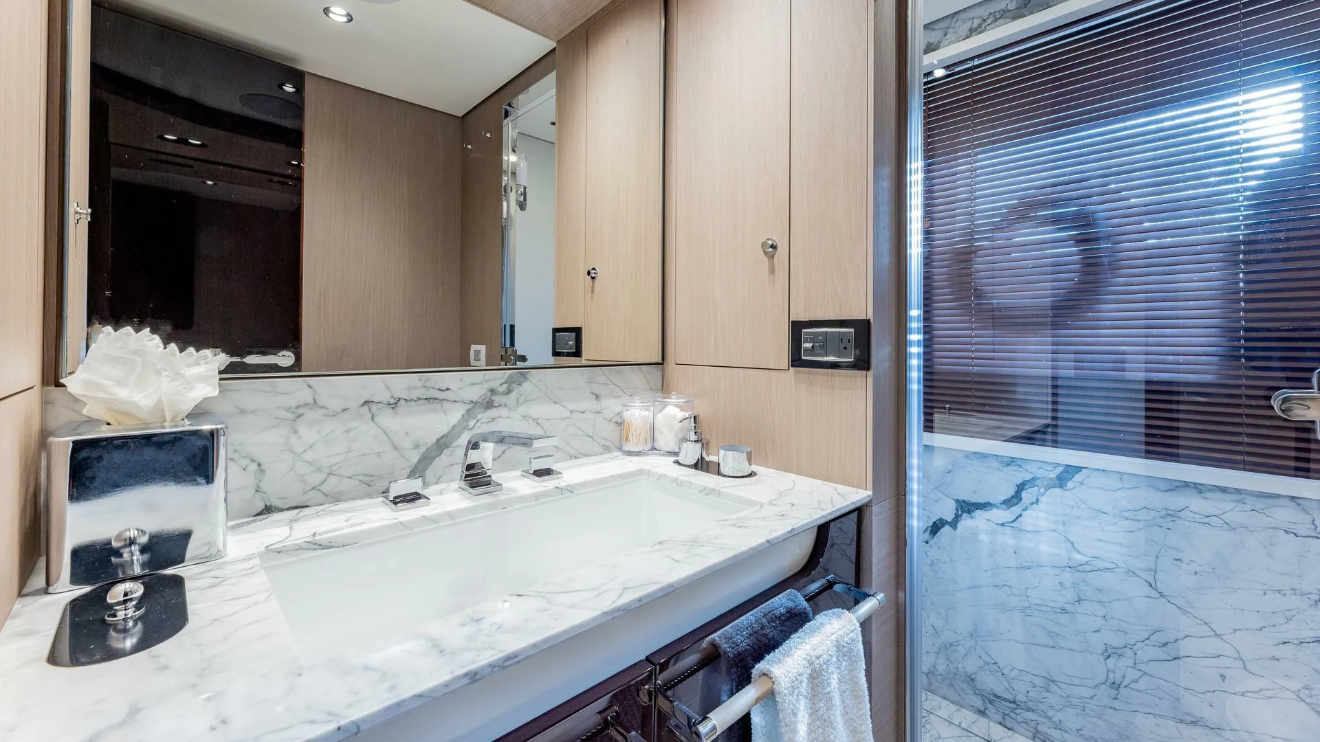 a bathroom with a sink and a mirror aboard CAPTAIN MORGAN II Yacht for Sale