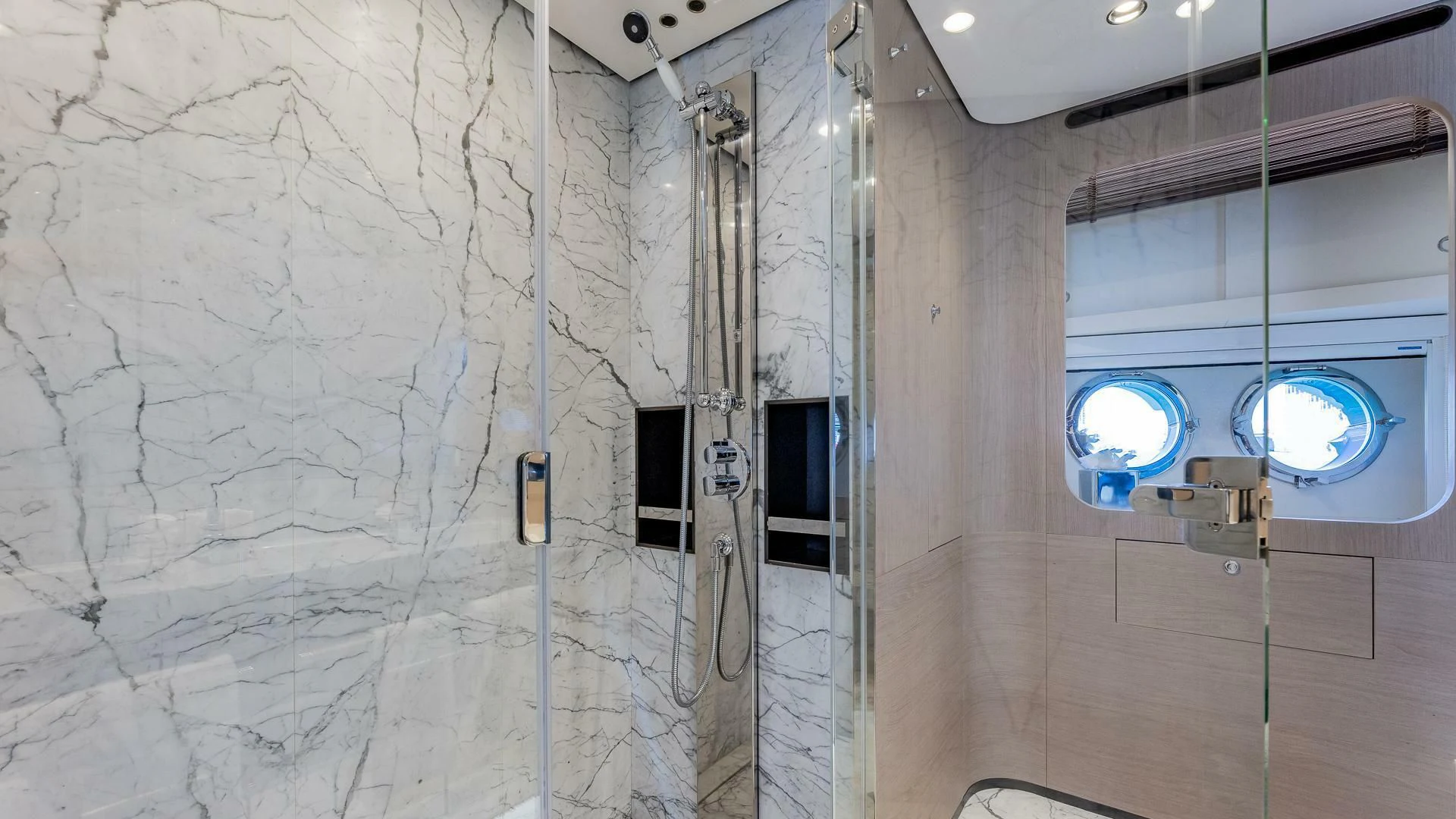 a room with a wall and windows aboard CAPTAIN MORGAN II Yacht for Sale