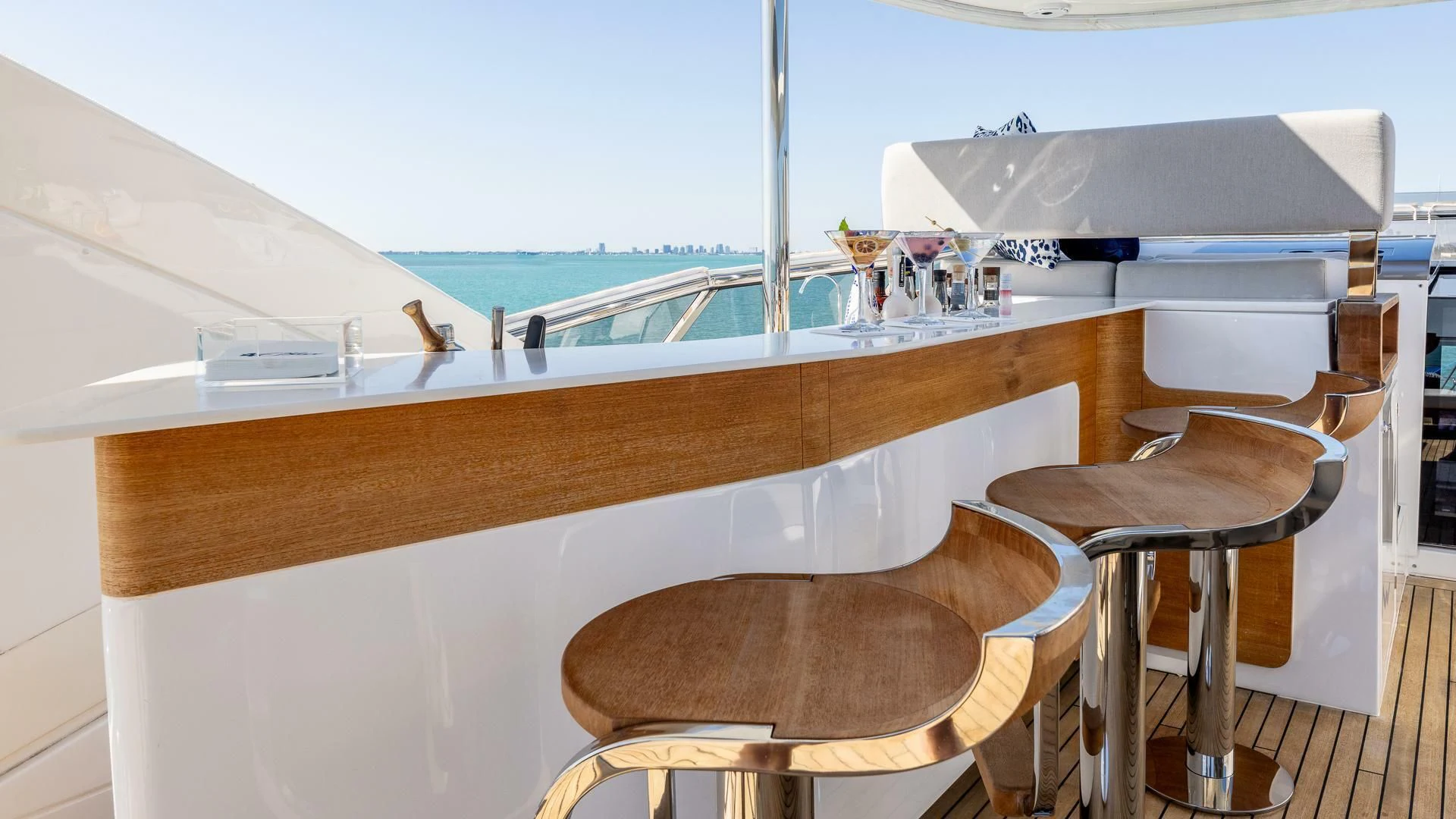 a table with chairs and a bench aboard CAPTAIN MORGAN II Yacht for Sale