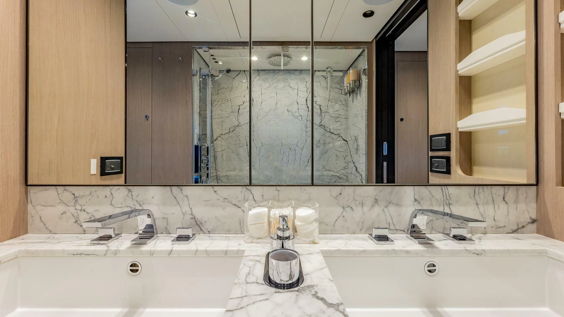 a bathroom with a large mirror aboard CAPTAIN MORGAN II Yacht for Sale