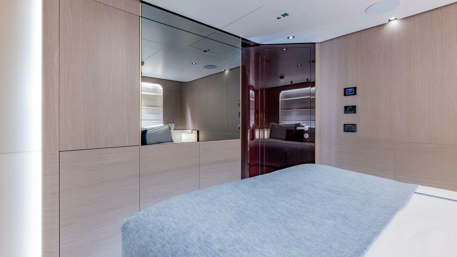 a large room with a bed and a desk aboard CAPTAIN MORGAN II Yacht for Sale