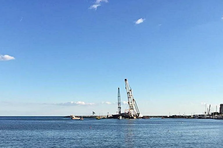 a large ship in the water aboard SUEGNO Yacht for Sale