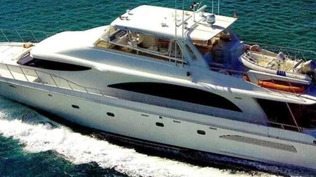 a white boat on the water aboard SELF MADE Yacht for Sale