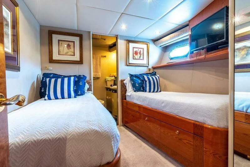 a room with two beds aboard SELF MADE Yacht for Sale