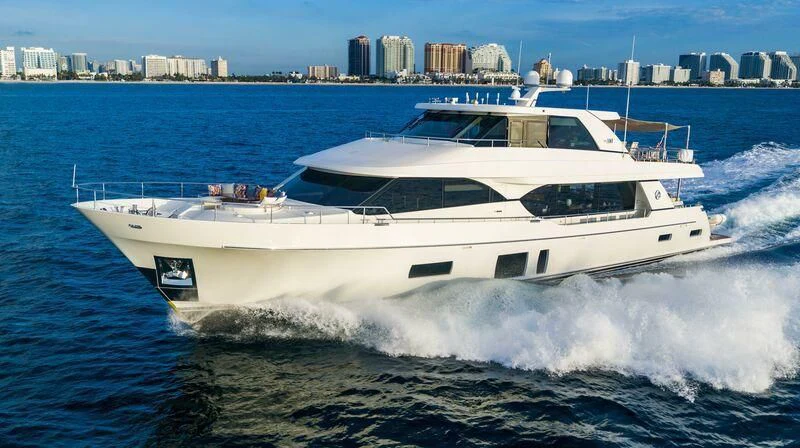 a white yacht on the water aboard AURA Yacht for Sale