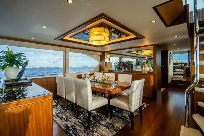 a living room with a large window aboard AURA Yacht for Sale