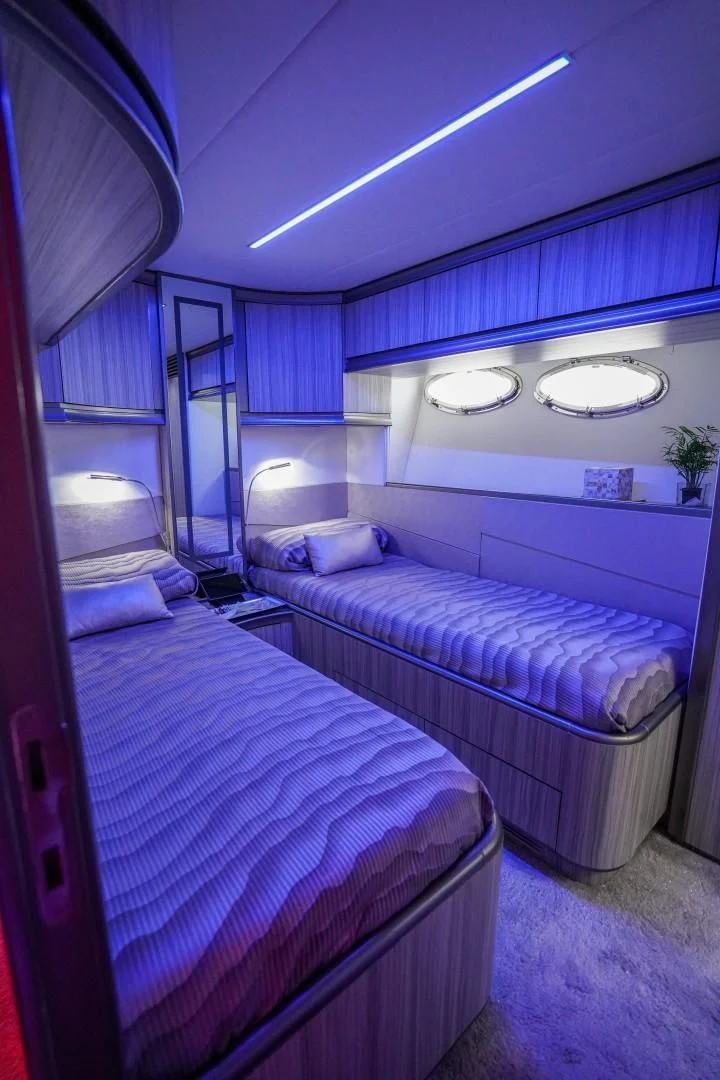 a couple of beds in a room aboard AMORA Yacht for Sale