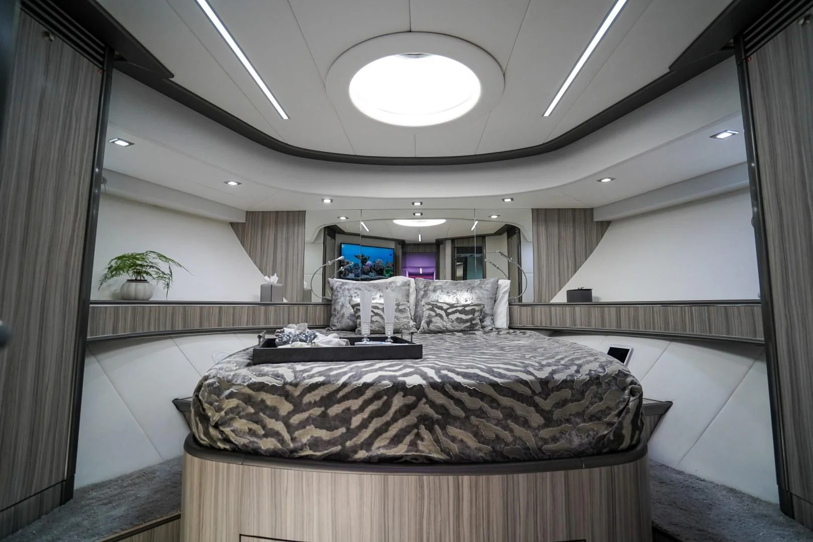 a room with a bed and a chair aboard AMORA Yacht for Sale