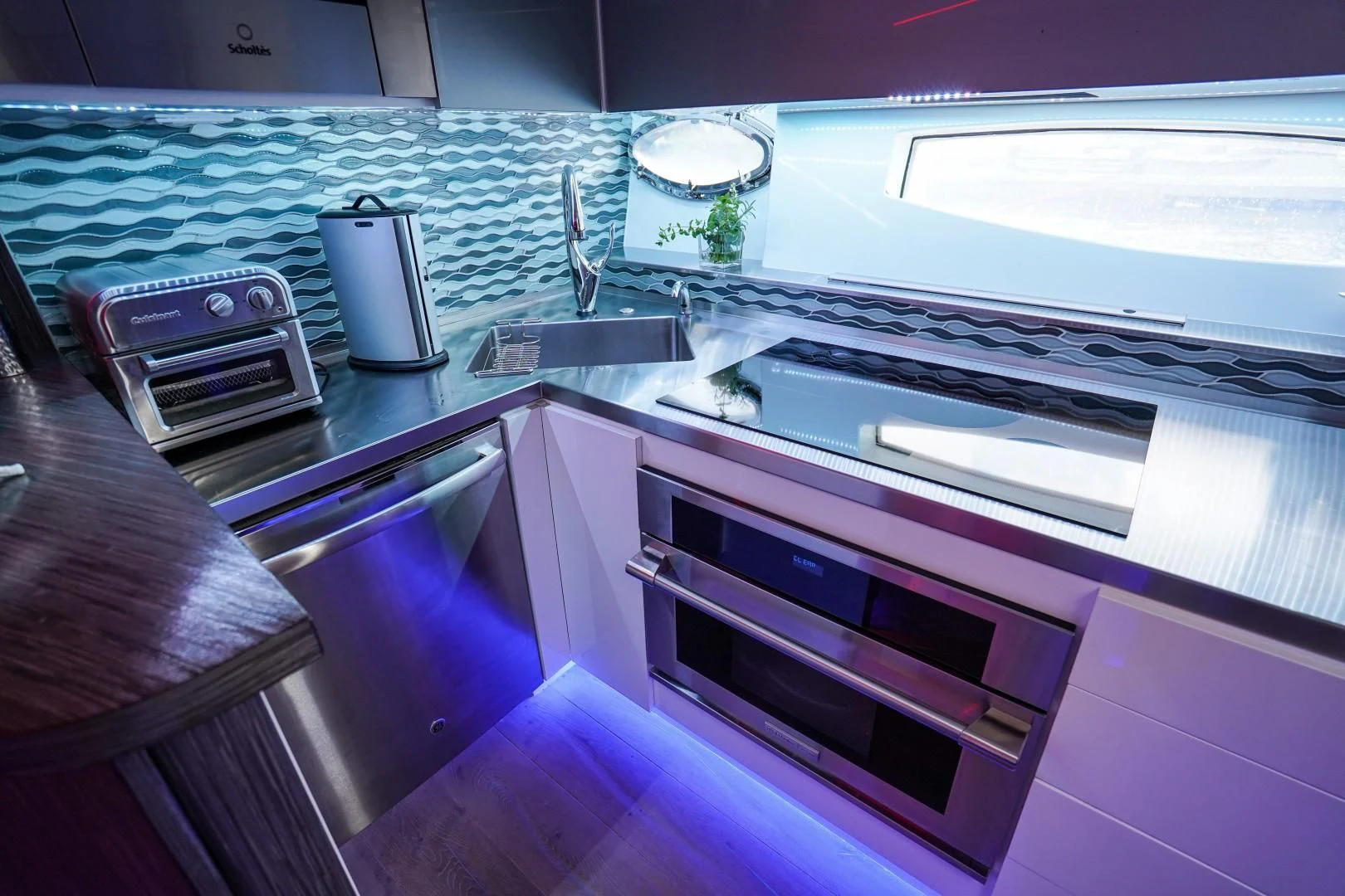 a kitchen with a purple and pink counter top aboard AMORA Yacht for Sale