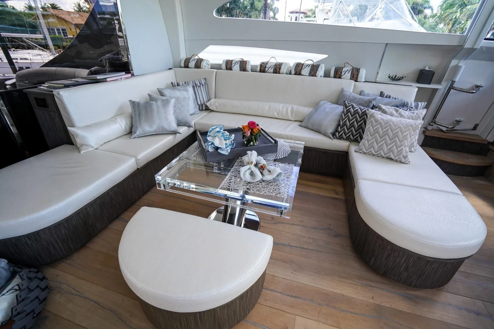 a living room with a couch and a coffee table aboard AMORA Yacht for Sale