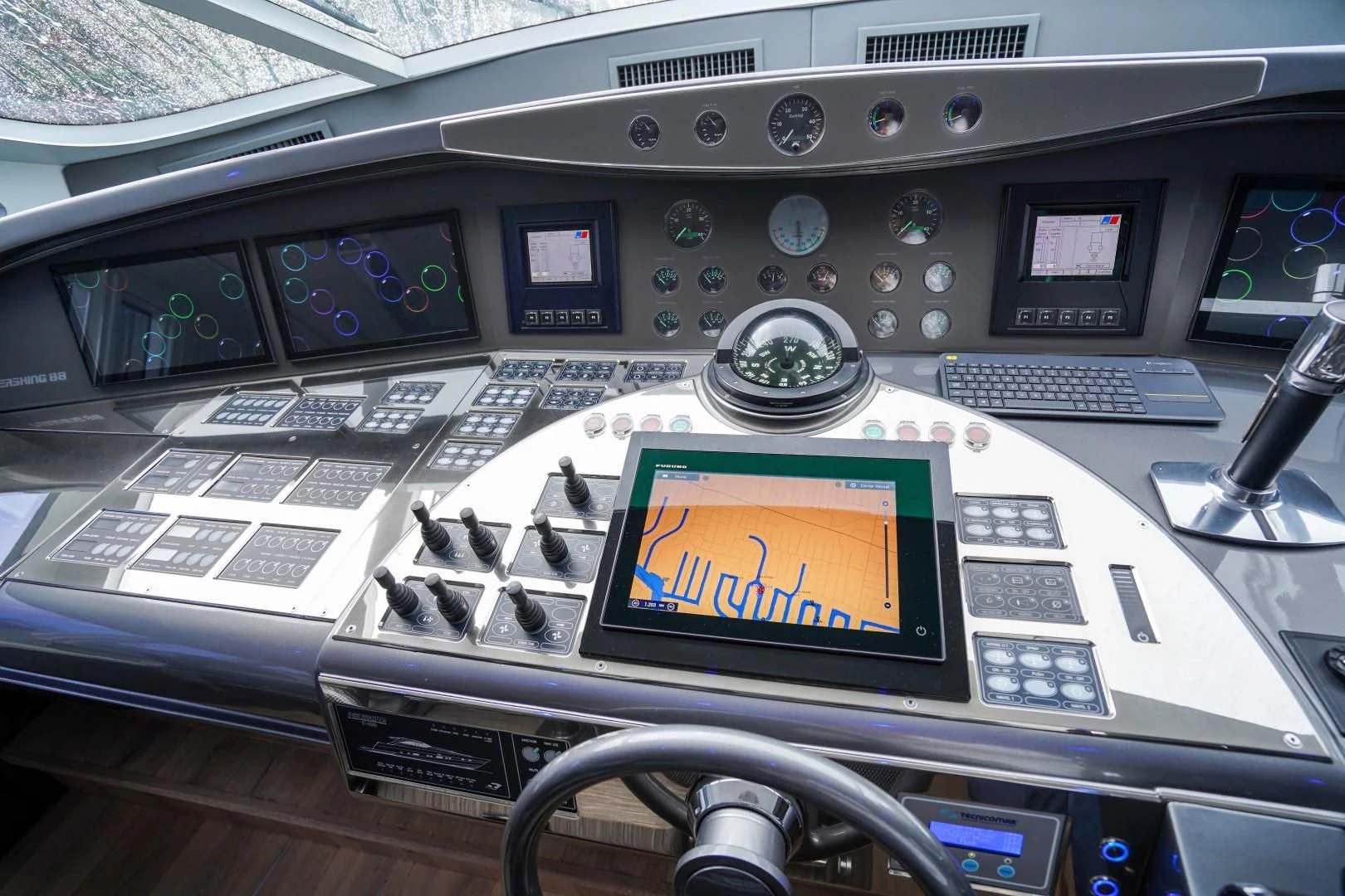 a console with a screen and buttons aboard AMORA Yacht for Sale